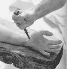 the nail being hammered into Jesus' hand
